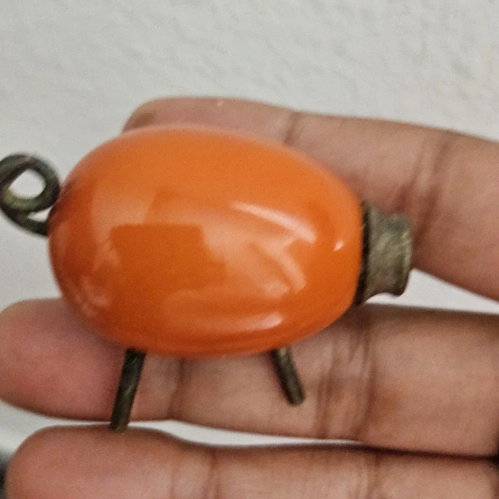 antique orange piggy shaped salt shaker with metal‎ legs and nose/spout